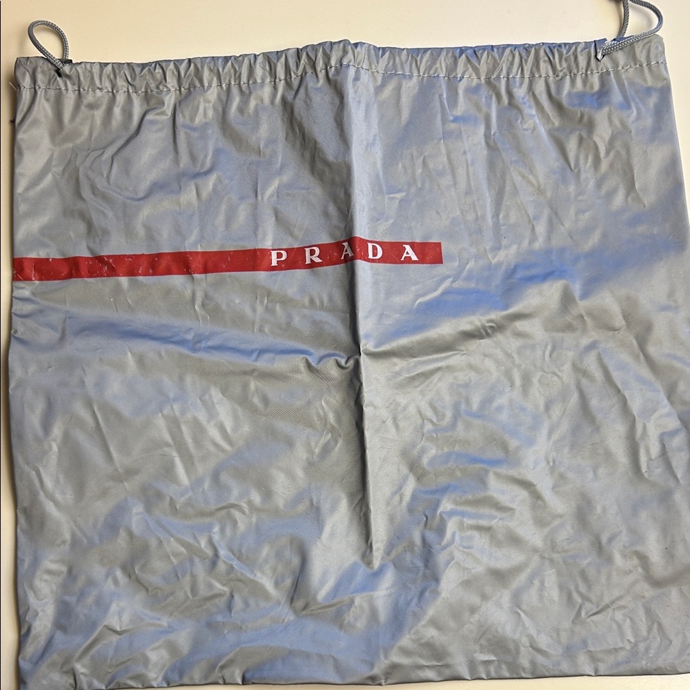 Prada Silver Dust Bag with Red Accent